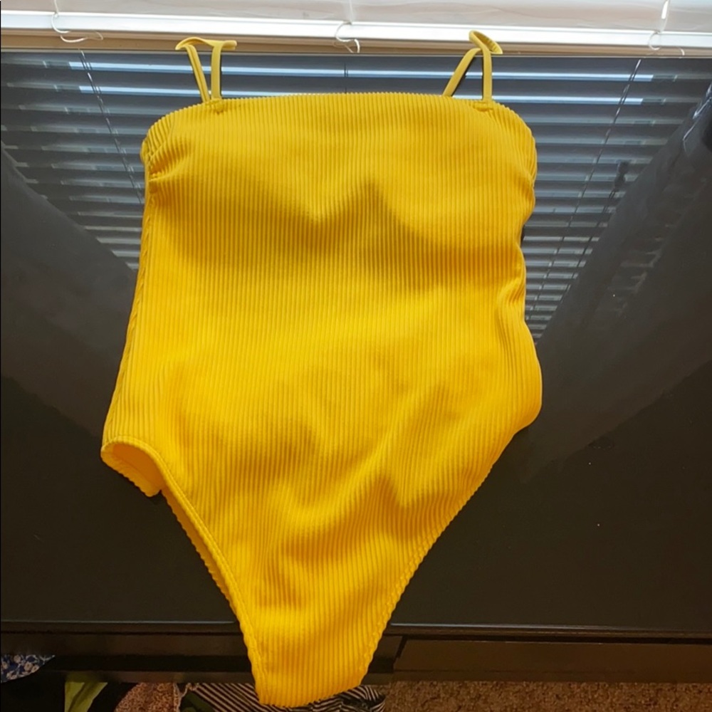 Brand New. Never worn. Hollister yellow One Piece
